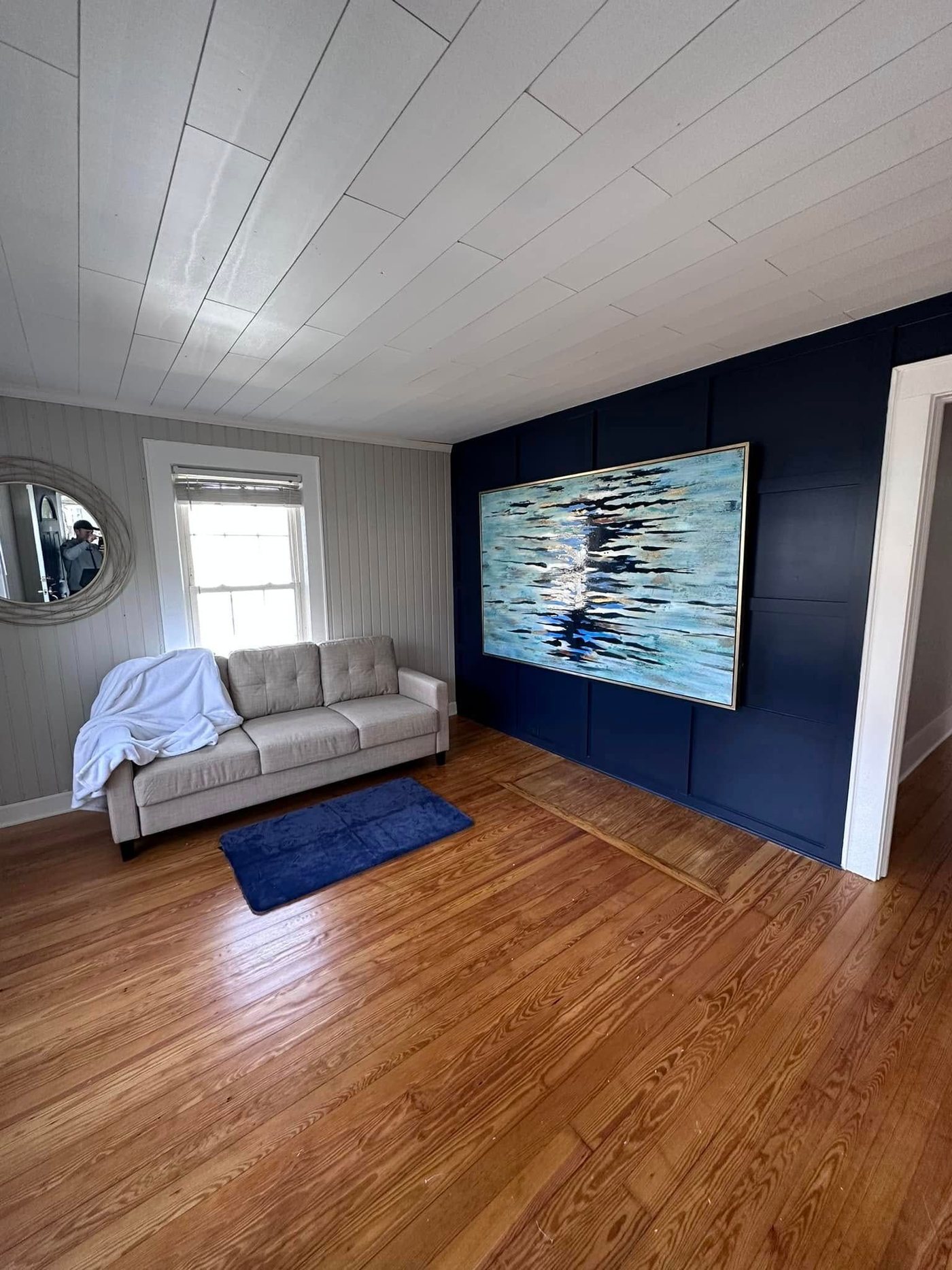 Navy panel wall with shiplap ceiling