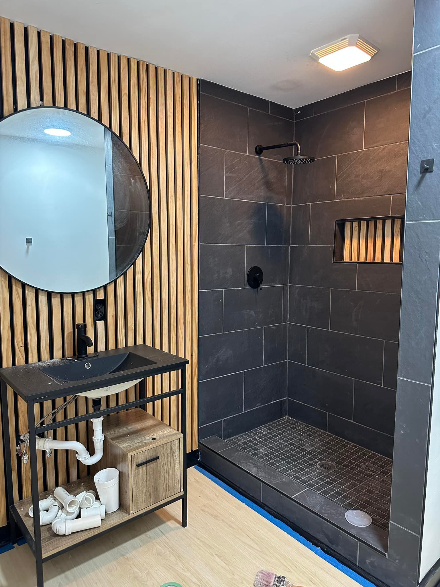 Walk-in shower with matte black fixtures