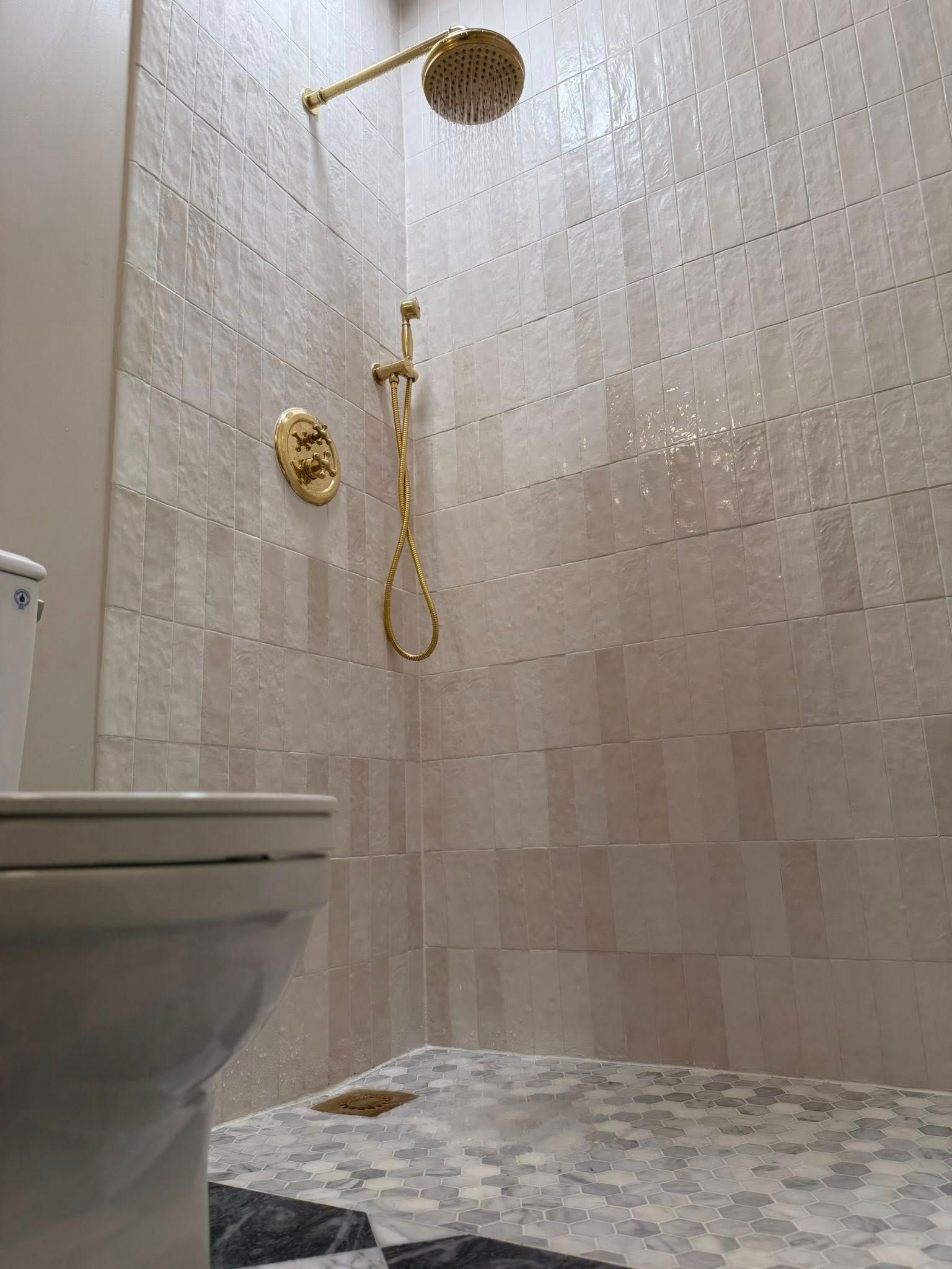 Shower with gold fixtures