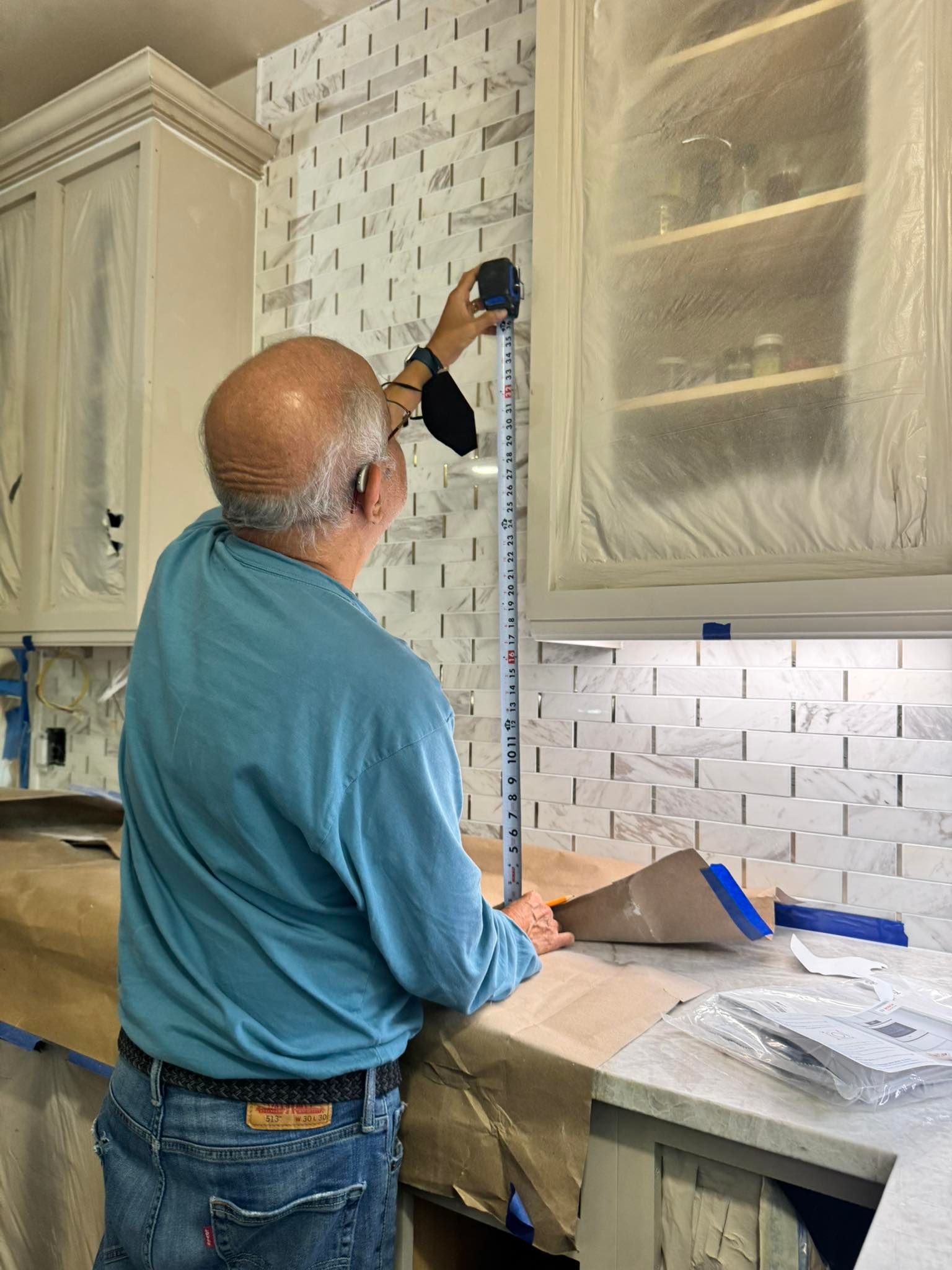 Beast Mode crew member laying out tile