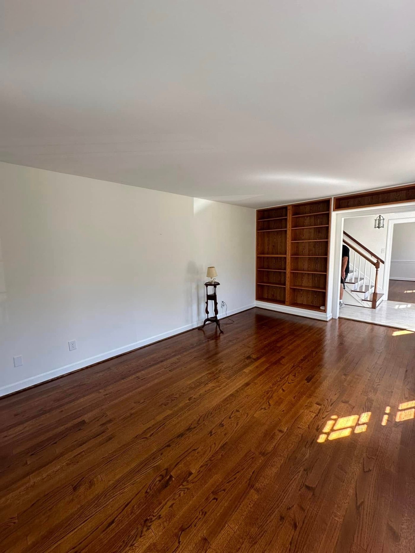 Refinished hardwood floors with built-in bookcase