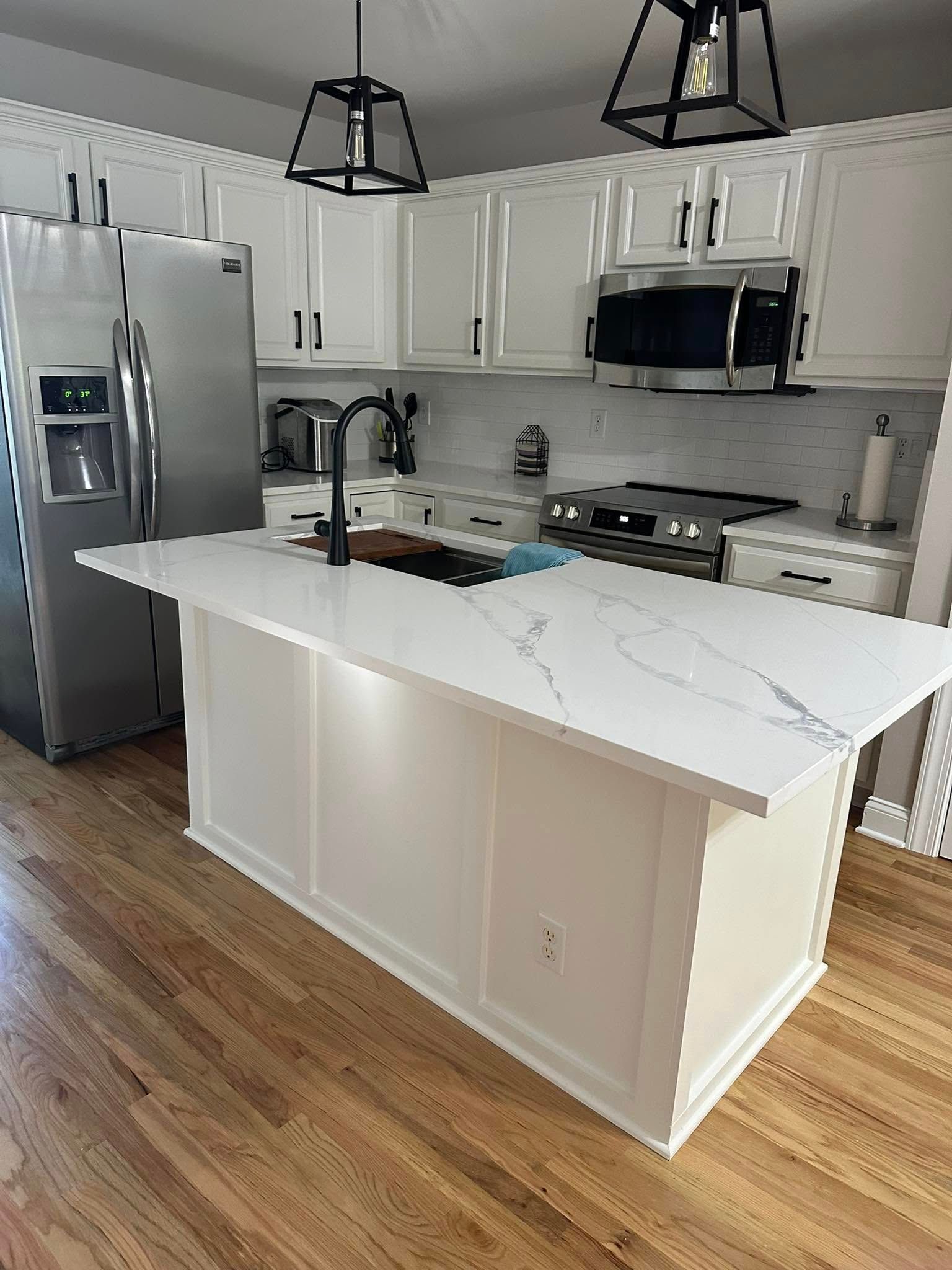 White kitchen with large island