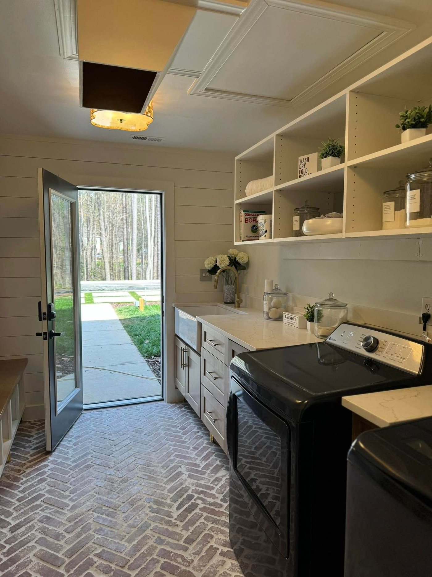 Laundry room remodel with shiplap and open shelving