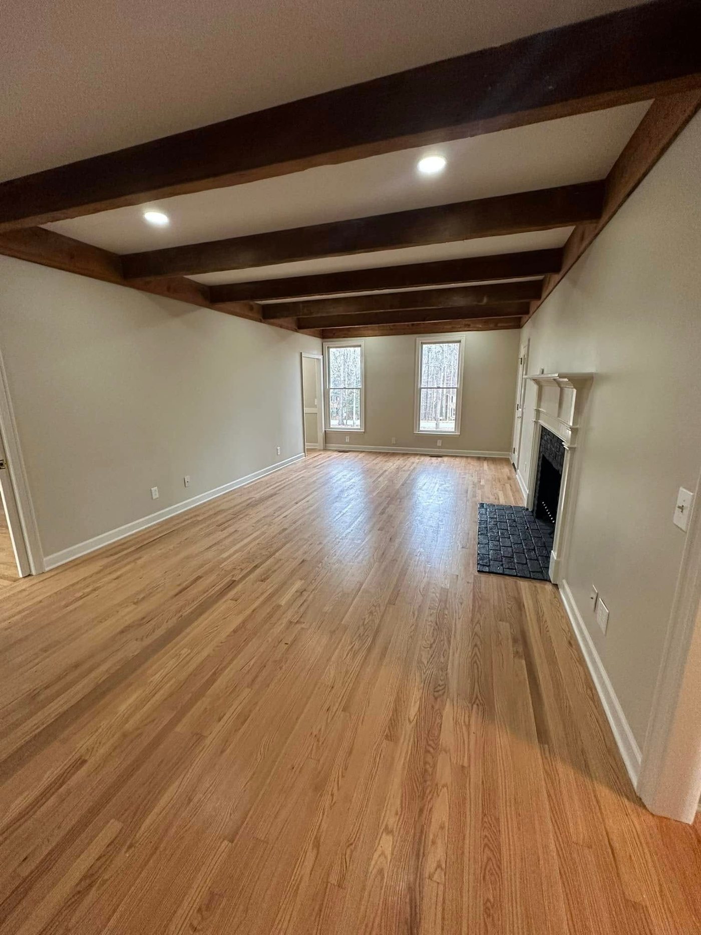 Living room with exposed beam ceiling